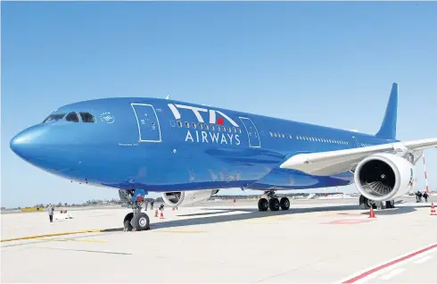  ?? REUTERS ?? ITA Airways’ plane with the blue livery is seen at Rome’s Fiumicino Airport in this file photo.