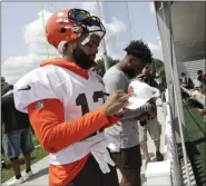  ?? TONY DEJAK — THE ASSOCIATED PRESS ?? Browns wide receiver Odell Beckham Jr. signs autographs after practice at the team’s training camp facility in Berea, Ohio, on Thursday.