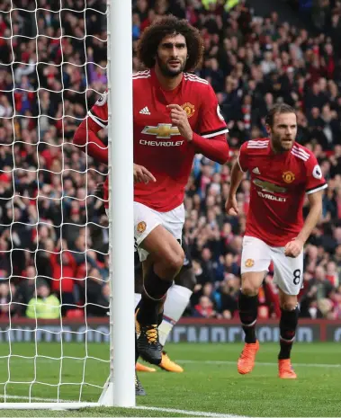  ?? Press Associatio­n; AP ?? Clockwise from above: Marouane Fellaini, second from the right, has turned boos to cheers at Manchester United and rewarded the trust manager Jose Mourinho, left, has shown him.
