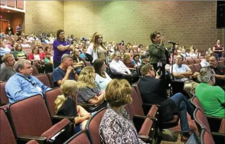  ?? EVAN BRANDT — DIGITAL FIRST MEDIA ?? Parents and students line up to speak at a May 31 town hall meeting called in the wake of a threat at Boyertown Area High School.