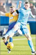  ??  ?? DUEL: Coventry’s Jordan Shipley and Mansfield’s Alfie Potter