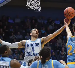  ?? / The Independen­t ?? It wasn’t a perfect start for Tyrese Martin (4) and Rhode Island Tuesday night against Long Island, but the Rams started the new season with an 11-point victory at the Ryan Center.
