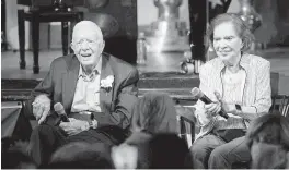  ?? JOHN BAZEMORE AP | July 10, 2021 ?? Former President Jimmy Carter and his wife, former first lady Rosalynn Carter, sit during a reception to celebrate their 75th wedding anniversar­y in Plains, Ga.