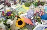  ?? ROSS GIBLIN/STUFF ?? Flowers laid outside the botanic gardens on Rolleston Ave in the weeks after the March 15 shootings.