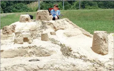  ?? MEGAN DAVIS/MCDONALD COUNTY PRESS ?? Two-time winner, Luke Kittlen took home $100 for his sprawling sand-mansion during the Sandcastle Building Contest on Saturday, June 18. Unlike many other builders, Kitlen opted to have his structure face Honey Creek for a better view.