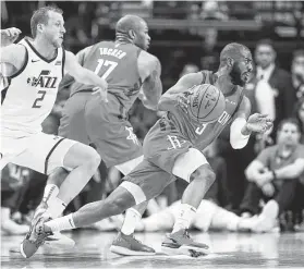  ?? Karen Warren / Staff photograph­er ?? Rockets guard Chris Paul (3) gets his motor running, going past Utah’s Joe Ingles (2) in Sunday’s first half. Paul netted 14 points and seven assists in a Game 1 rout.