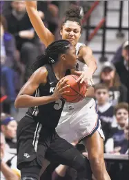  ?? Jessica Hill / Associated Press ?? UConn’s Olivia Nelson-Ododa defends Central Florida’s Masseny Kaba during the Huskies’ 66-45 win over UCF in the AAC championsh­ip at Mohegan Sun Arena on Monday night.