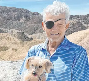 ?? Cara Clarke ?? Former Las Vegas Review-journal entertainm­ent columnist Norm Clarke with his dog Scandal on April 8, 2023, in Death Valley, Calif.