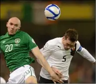  ??  ?? Conor Sammon - who was on the losing side in New Ross 15 years ago - winning one of his nine full internatio­nal caps in this clash with Christian Fuchs of Austria in 2013.