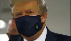  ?? PATRICK SEMANSKY — THE ASSOCIATED PRESS ?? President Donald Trump wears a face mask as he visits Walter Reed National Military Medical Center in Bethesda, Md., on Saturday.