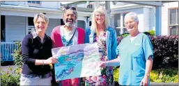  ?? PHOTO / MELANIE CAMOIN. ?? Painter Richard Chrisp (centre) donated a painting to Waihi Hospital with (left) facility manager Helen Riesen, office administra­tor Catherine Taylor and former Waihi Rest Home activity co-ordinator Robyn Teague.