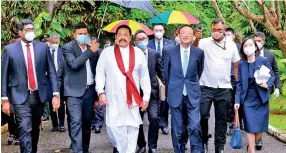  ??  ?? Bin the facemasks: Chinese delegation leader Yang Jeichi seen with Prime Minister Rajapaksa at Temple Trees last week