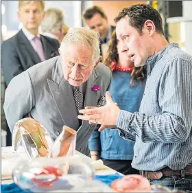  ??  ?? Prince Charles is shown glass works yesterday by Charlie MacPherson