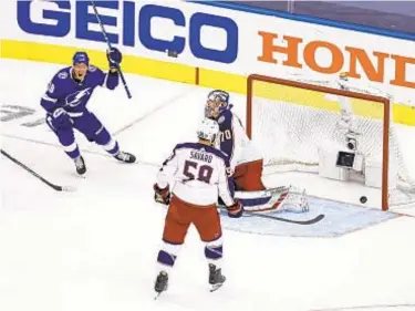  ?? GETTY ?? Ondrej Palat celebrates game-winning goal by Brayden Point as Tampa Bay beats Columbus in five overtimes to open first round of Stanley Cup playoffs on Tuesday.