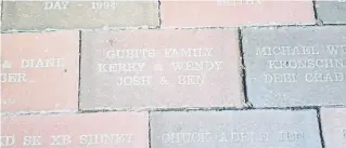  ?? Photos courtesy of Kerry Gubits ?? A commemorat­ive brick at the fans’ pavilion at Coors Field honors Kerry and Wendy Gubits and their two sons.