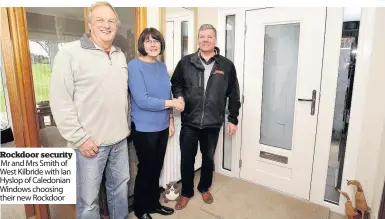  ??  ?? Rockdoor security Mr and Mrs Smith of West Kilbride with Ian Hyslop of Caledonian Windows choosing their new Rockdoor