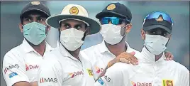  ?? AFP ?? Sri Lanka players wore masks to ward off effects of haze and smoke at the Ferozeshah Kotla.