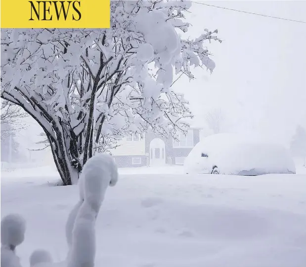  ?? @KHAYWARD17/TWITTER ?? A late-spring storm buried cars in snow and closed a slew of schools on Newfoundla­nd’s northeast coast Thursday.