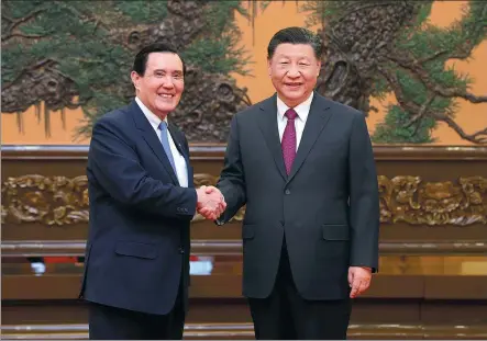  ?? JU PENG / XINHUA ?? Xi Jinping, general secretary of the Communist Party of China Central Committee, meets with Ma Ying-jeou, former chairman of the Chinese Kuomintang party, in Beijing on Wednesday.