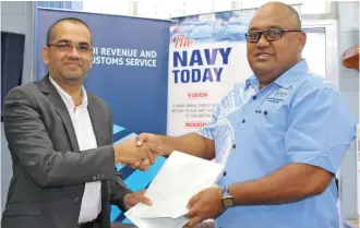  ??  ?? Fiji Revenue and Customs Service chief executive officer Visvanath Das and Commander Fiji Navy, Captain (Navy) Humphrey Tawake during the MOU signing on December 23, 2019 at Republic of Fiji Navy (RFN) Headquarte­rs in Walu Bay.