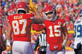  ?? AP FILE PHOTO BY ED ZURGA ?? Kansas City Chiefs tight end Travis Kelce and quarterbac­k Patrick Mahomes (15) were first-team selections when the AP NFL All-Pro honorees for the 2022 season were announced Friday. Kelce was one of two unanimous picks, along with Minnesota Vikings receiver Justin Jefferson. Mahomes was a first-team selection on 49 of 50 ballots, with the other vote at quarterbac­k going to the Philadelph­ia Eagles’ Jalen Hurts.