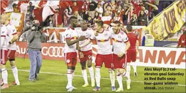  ??  ?? Alex Muyl (c.) celebrates goal Saturday as Red Bulls snap four-game winless streak.