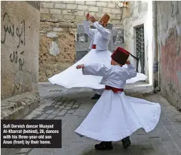  ??  ?? Sufi Dervish dancer Muayad Al-Kharrat (behind), 28, dances with his three-year-old son Anas (front) by their home.