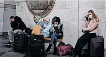  ?? ?? PEOPLE took shelter in a metro station as air raid sirens rang out in downtown Kyiv on February 24, 2022. Cities across Ukraine were hit with Russian missile strikes. | AFP