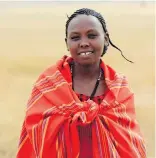  ??  ?? Judy Koya, a member of Kenya’s Maasai tribe on a training mission in the Maasai Mara region.