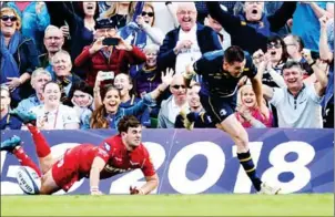  ?? AFP ?? Leinster fly-half Johnny Sexton scores a try in their European Champions Cup semifinal with Scarlets at Aviva Stadium in Dublin on Saturday.