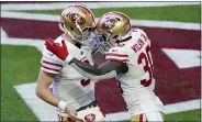  ?? ROSS D. FRANKLIN — THE ASSOCIATED PRESS ?? San Francisco 49ers running back Jeff Wilson (30) celebrates his TD against the Arizona Cardinals with QB C.J. Beathard during Saturday’s game in Glendale, Ariz.