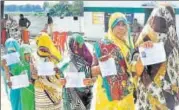  ?? PTI ?? Voters queue up at a polling booth in Phulpur, Uttar Pradesh, on Sunday. The voter turnout stood at 37.39%.