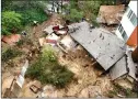  ?? ?? Mud sweeps away an L.A. home.