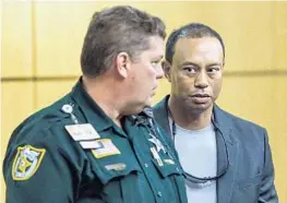  ?? POOL/GETTY IMAGES ?? Golf star Tiger Woods pleaded guilty to a reckless driving misdemeano­r on Friday.