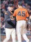  ?? JEFF CHIU/AP PHOTO ?? San Francisco Giants manager Bruce Bochy, left, takes the ball from pitcher Matt Moore in the eighth inning of a game against the Phillies on Aug. 18, 2017, in San Francisco.