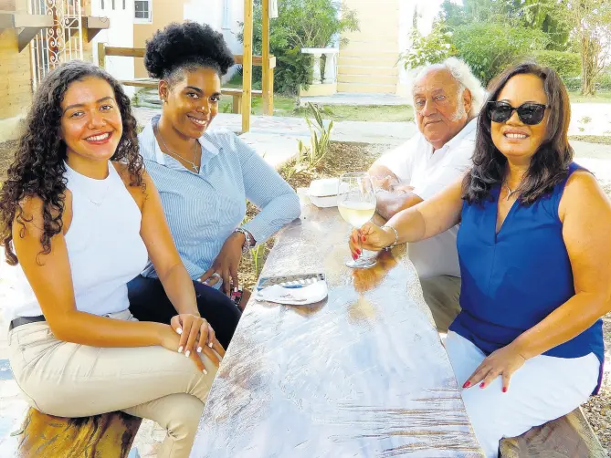  ?? PHOTOS BY CARL ?? Frank Rance (3rd left) with, from left, daughter Victoria, manager of L’Escargot restaurant, Trishawana Davidson, executive assistant manager at FDR, and his wife Angella. GILCHRIST