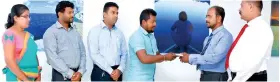  ??  ?? People’s Bank Kandy Regional Manager Emil Mendis awards a Hatharaliy­adda branch loan to an entreprene­ur at