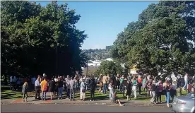  ?? MIKE DINSDALE — NEW ZEALAND HERALD VIA AP ?? People gather on high ground in Whangarei, New Zealand, as a tsunami warning is issued Friday.