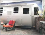  ??  ?? A VINTAGE Airstream trailer serves as a playful entrance to a bedroom within the Studio City house.
