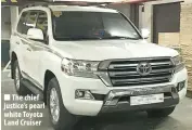  ??  ?? The chief justice’s pearl white Toyota Land Cruiser