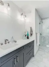  ??  ?? The ensuite in the master bedroom features a quartz-topped maple vanity.