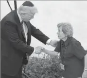  ?? AFP ?? Donald Trump with Holocaust survivor Margot Herschenba­um at the Yad Vashem Holocaust Memorial Museum in Jerusalem.