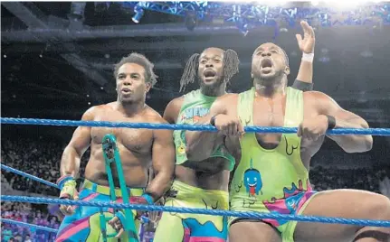  ?? COURTESY OF WWE ?? Kofi Kingston, center, with New Day tag team partners Xavier Woods, left, and Big E, will be in Orlando tonight for WWE’s SmackDown Live.