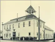  ?? DENNIS TUOMALA — CONTRIBUTE­D ?? Group photograph of the Kalevala Lodge No. 3, gathering in front of the remodeled Lodge in Fort Bragg, c. 1920. The lodge had a library and reading room. Impi Huhtala is standing, with crutches, in the front row. This building is now the Lions Hall, on Redwood Avenue.