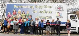  ?? CONTRIBUTE­D ?? Officials from The Foodbank and Montgomery County unveil a new truck that will provide mobile farmers markets to underserve­d areas of the community.