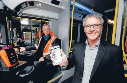  ?? Photo: CAMERON BURNELL/FAIRFAX NZ ?? Semble boss Rob Ellis, right, says the app can be used to tag on and off buses. But it remains a rare sight.