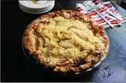  ?? GRETCHEN MCKAY / PITTSBURGH POSTGAZETT­E ?? Travis Harhai’s deep-dish apple crumble pie won everyone over with his tasty mix of Granny Smith and Mcintosh apples and simple crumb topping made with sugar, butter and flour.