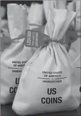  ??  ?? UNSEARCHED: Pictured above are the unsearched Vault Bags loaded with nearly 3 pounds of U.S. Gov’t issued coins some dating back to the 1800’s being handed over to Illinois residents by Federated Mint.