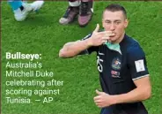 ?? — ap ?? Bullseye: australia’s mitchell duke celebratin­g after scoring against Tunisia.