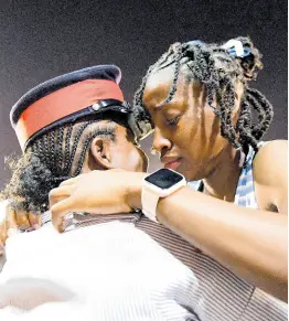  ?? GLADSTONE TAYLOR MULTIMEDIA PHOTO EDITOR ?? A teary-eyed Theianna-Lee Terrelonge seeks comfort from her mom, Corporal Desrine Chambers, moments after taking gold in the Class 2 girls’ 100 metres at the ISSA/GraceKenne­dy Boys’ and Girls’ Athletics Championsh­ips inside the National Stadium in St Andrew yesterday.